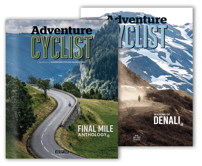Two issues of Adventure Cyclist Magazine