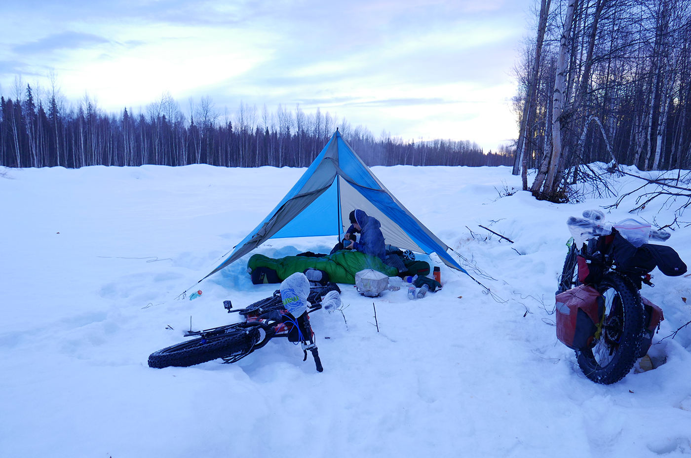 Katie breaks camp on her Iditarod adventure cycling trip.