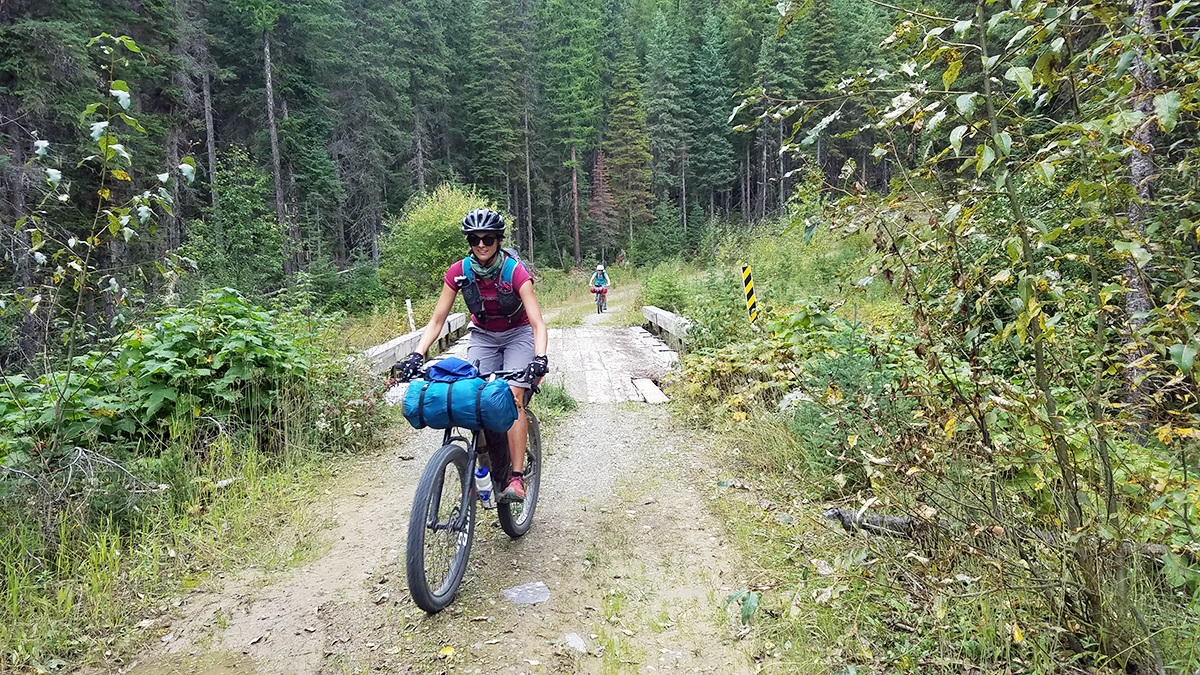 Jessica biking on the Great Divide Mountain Bike Route in Canada