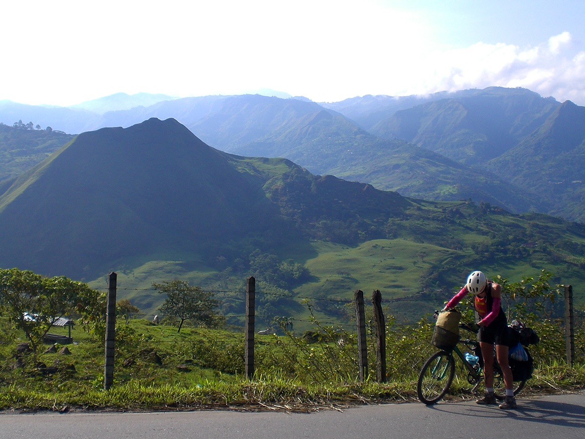 Laura pushes her bike up the mountains of southern Colombia.