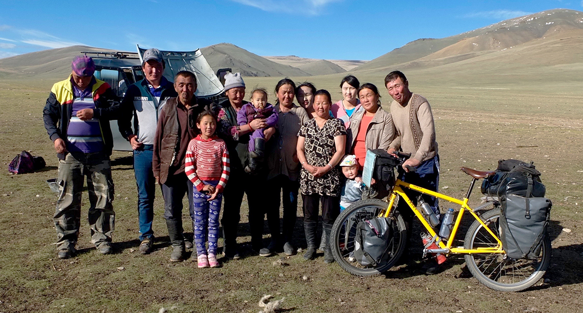 Several generations of a Mongolian family gather for a photo