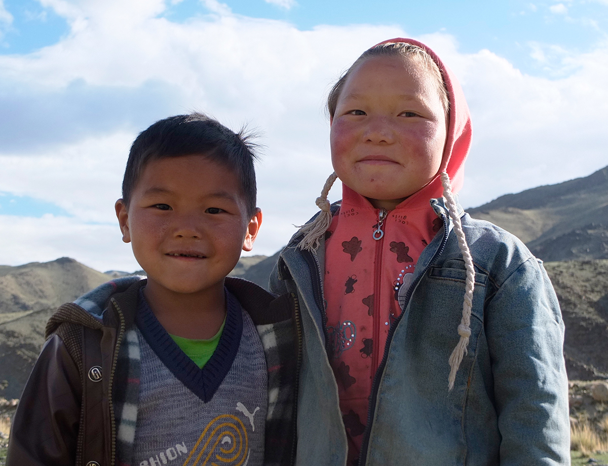 Two Mongolian children pose for the camera