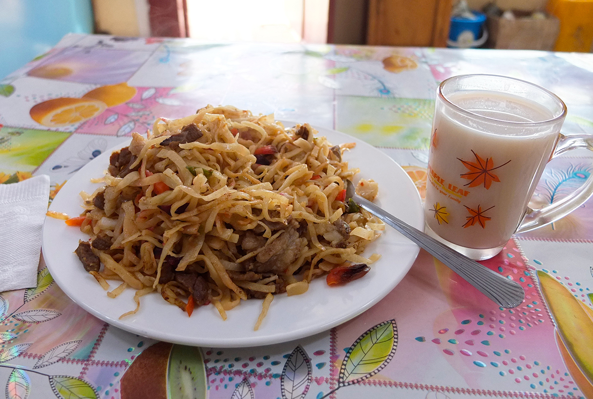 A big plate of tsuvian and a cup of salty, milky tea