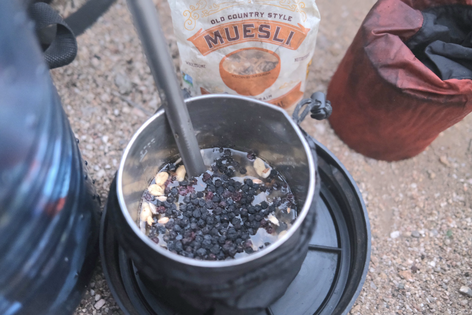 a camp stove with dried fruit and granola 