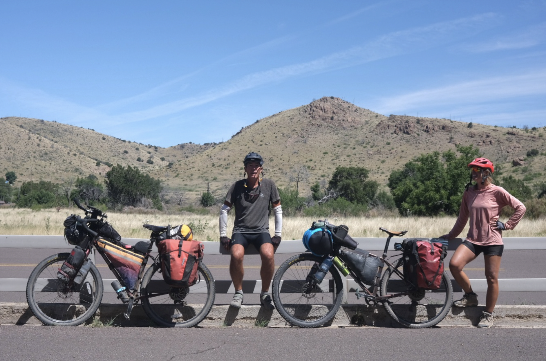 a group of cyclists in the desert