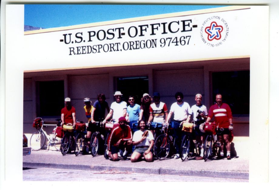 A group of cyclists in front of the Reedsport post office.