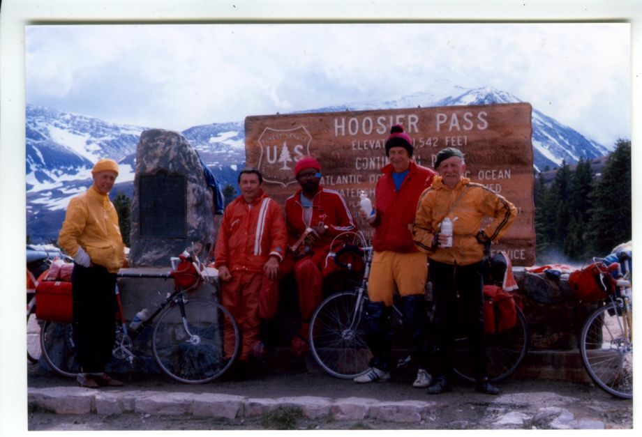Five men in front of the sign for Hoosier Pass