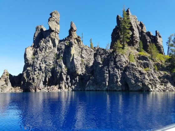 Tall spires of rocks jutting out of water.