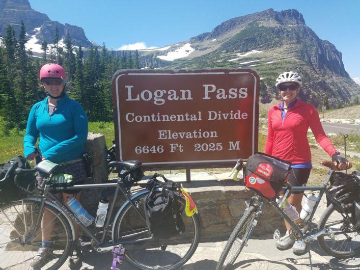 bike travelers at the top of Logan Pass
