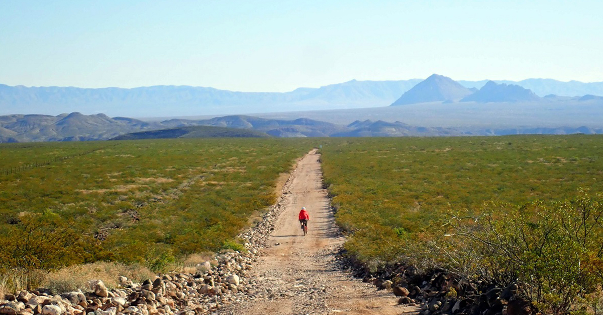 Alissa bikepacking on gravel roads in New Mexico