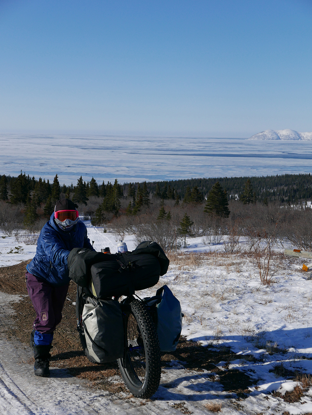 Steep hills near Shaktoolik with the Bering Sea in the background.