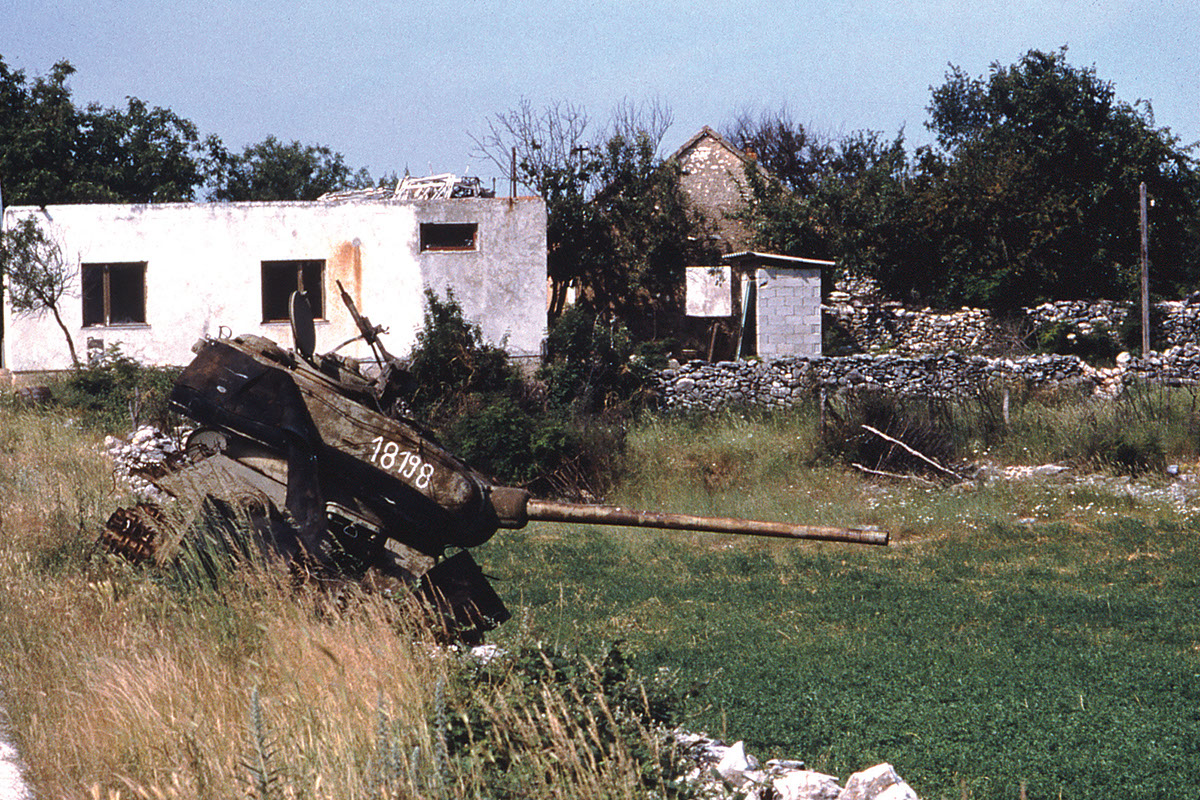 Willie Weir pedals through Bosnia after the war