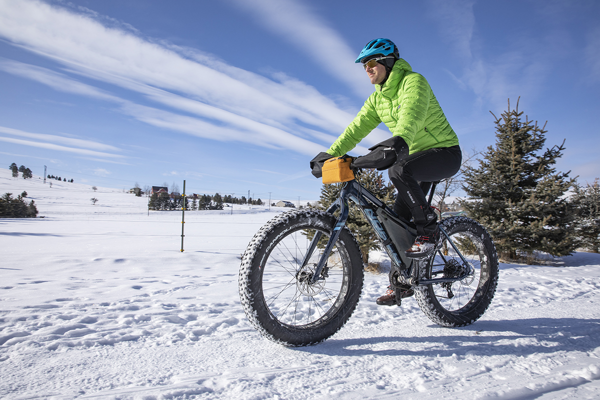 Riding a fat bike on snow.