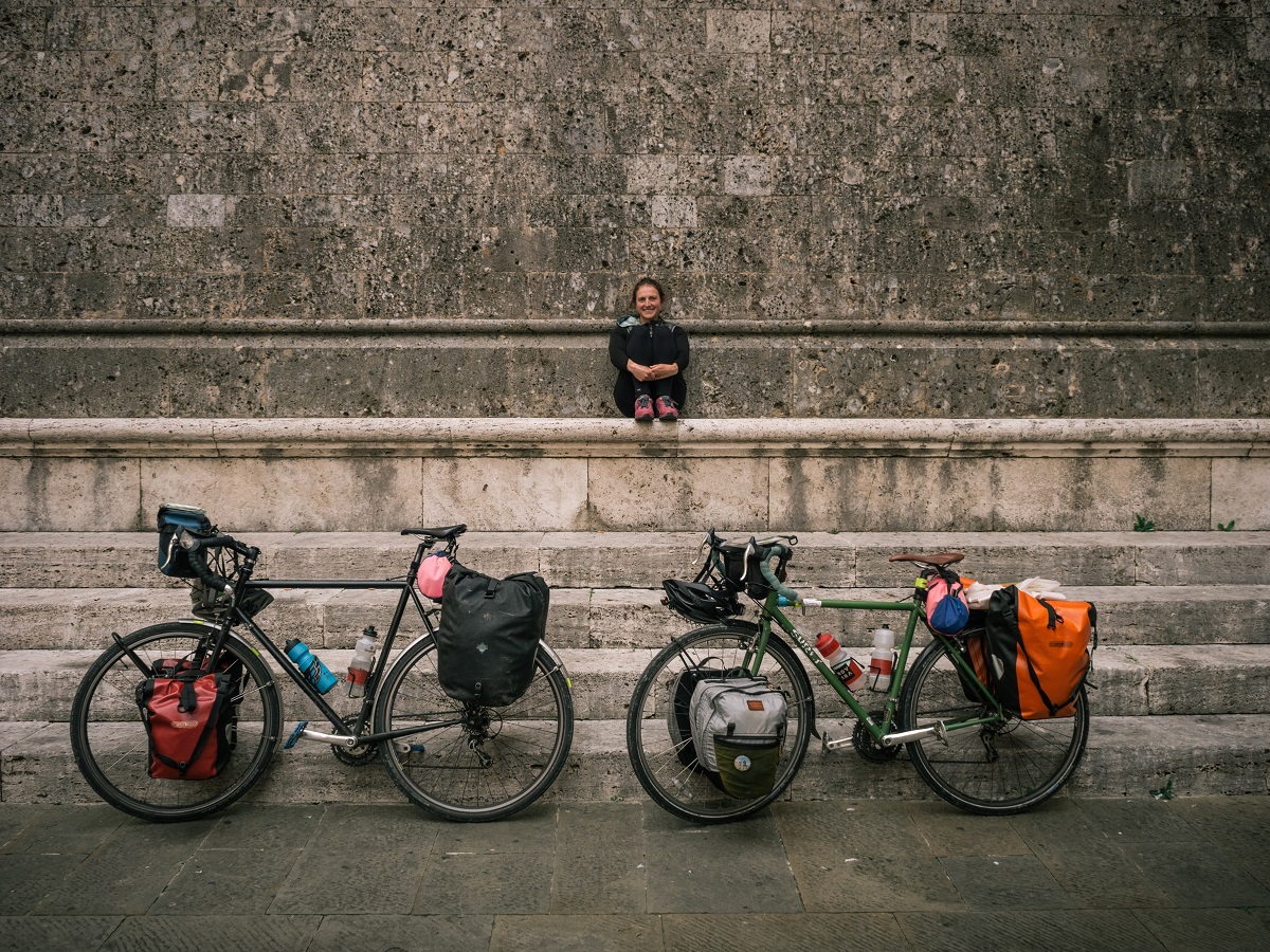 Kelsey Pasteris waits with fully loaded bikes.