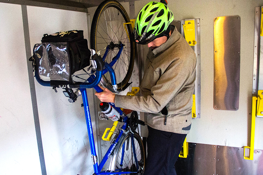 Jeff secures his bike on Amtrak car.