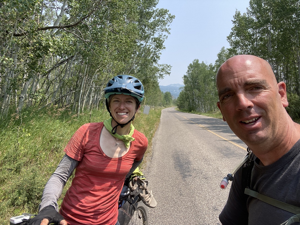 Scott, a bald white man, takes a selfie with Alissa when they meet on the route.