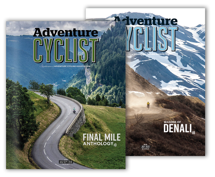 Two issues of Adventure Cyclist Magazine