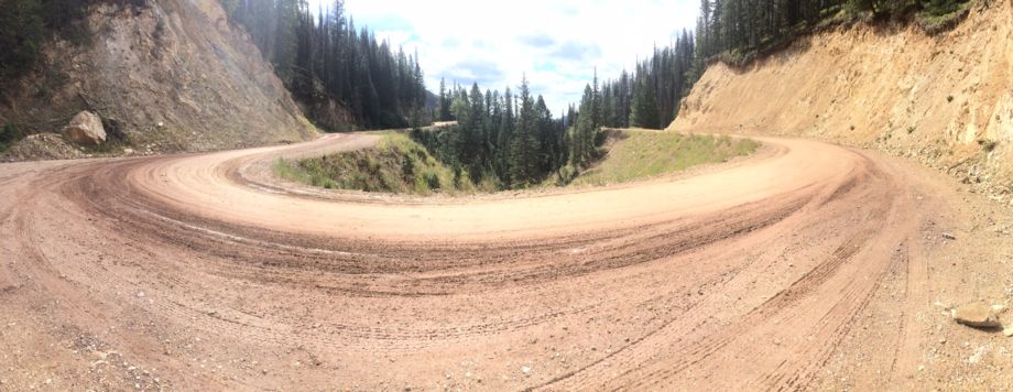 Wide view of a winding dirt road