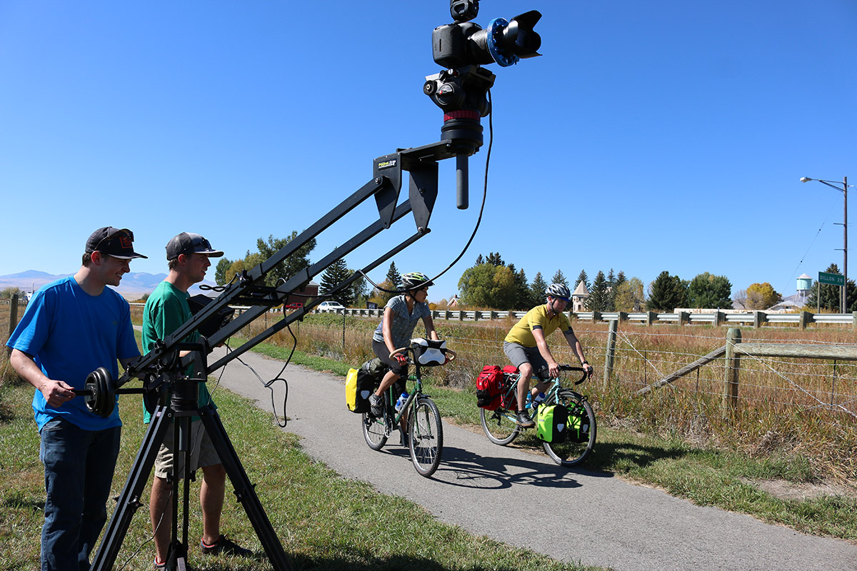 Camera crew filming cyclists on a bike path