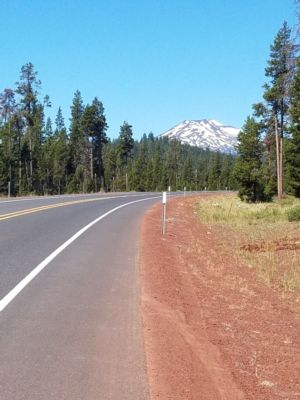 Flat-topped mountain with some snow in the distance