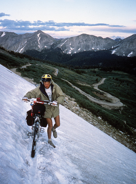 Bike touring in the mountains sometimes means a bit of hiking, and a bit of snow.