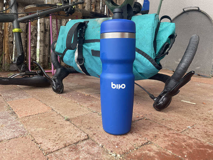 Blue Bivo bottle on a tile floor