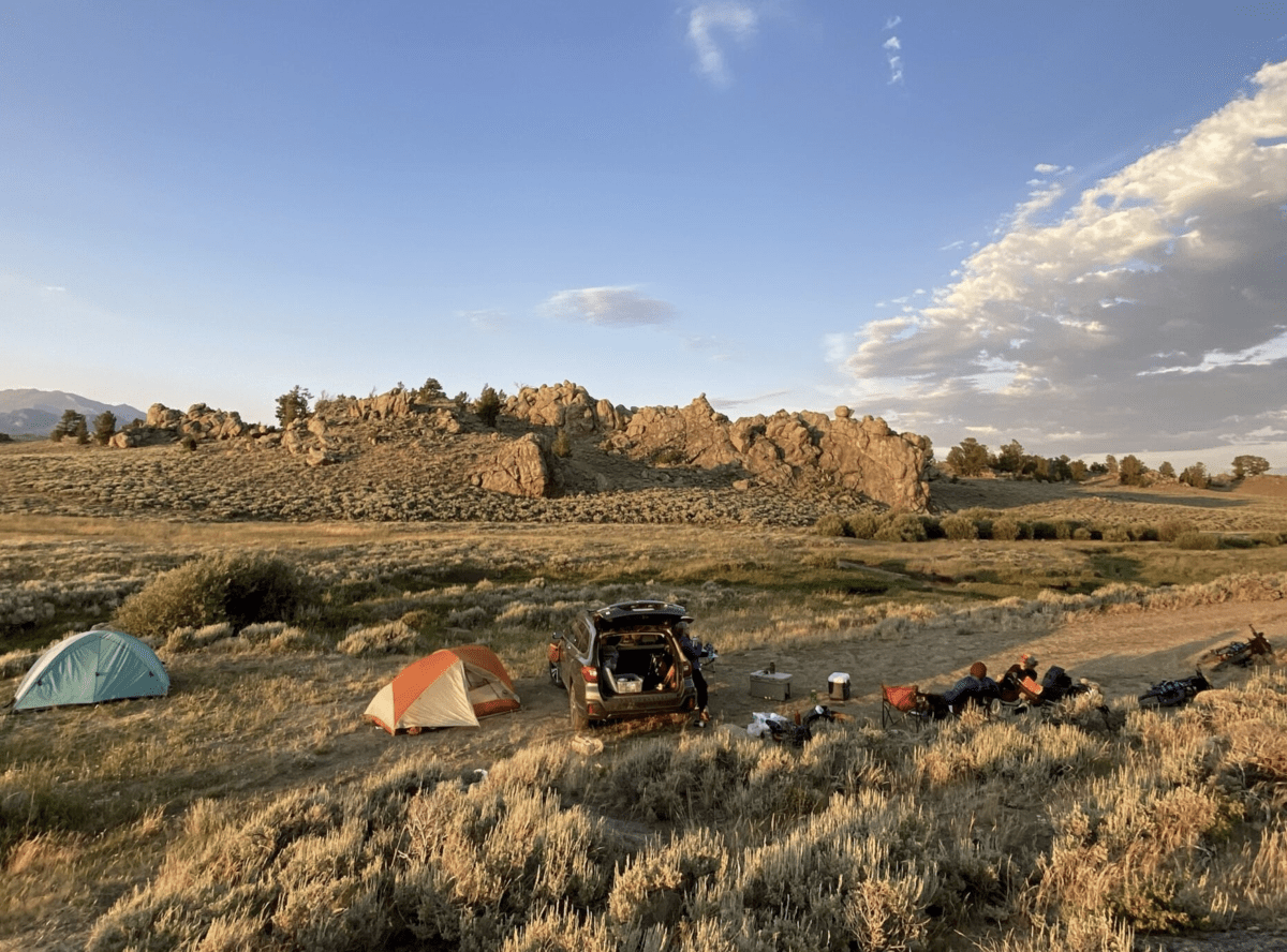 bikes and a car at sunset in the desert 