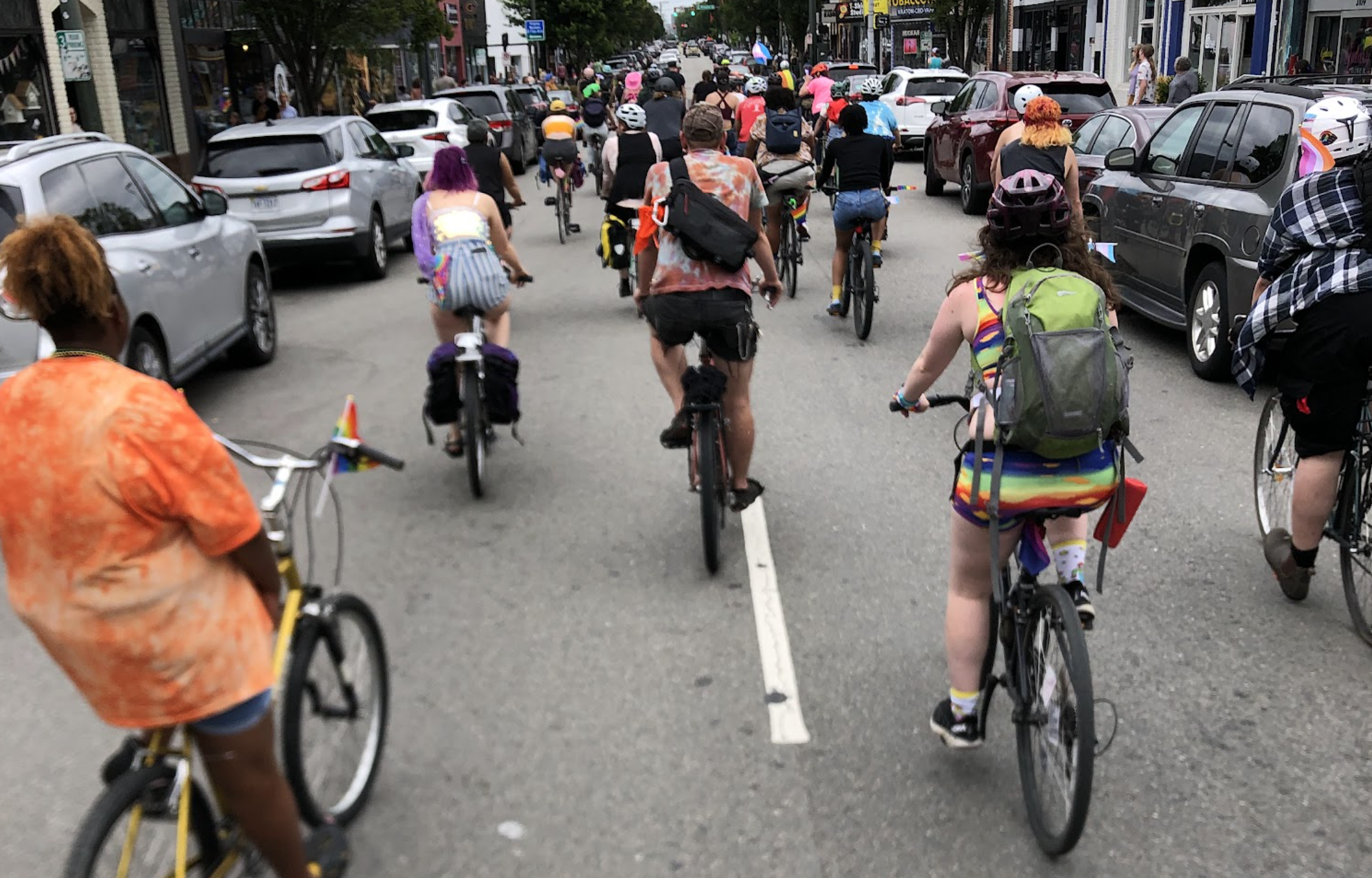 a group of cyclists on a city road
