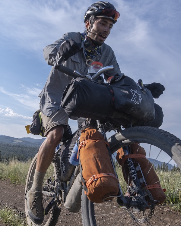 A bike with lots of straps and bags