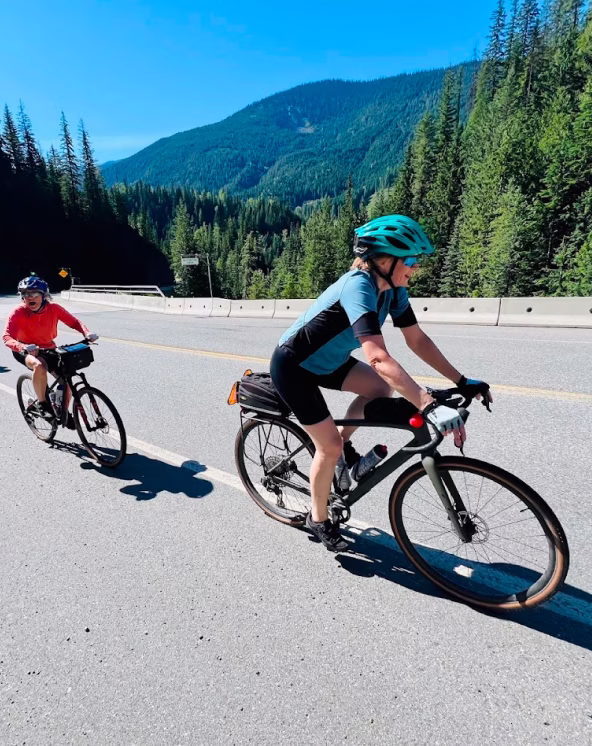 Cyclists riding on paved road